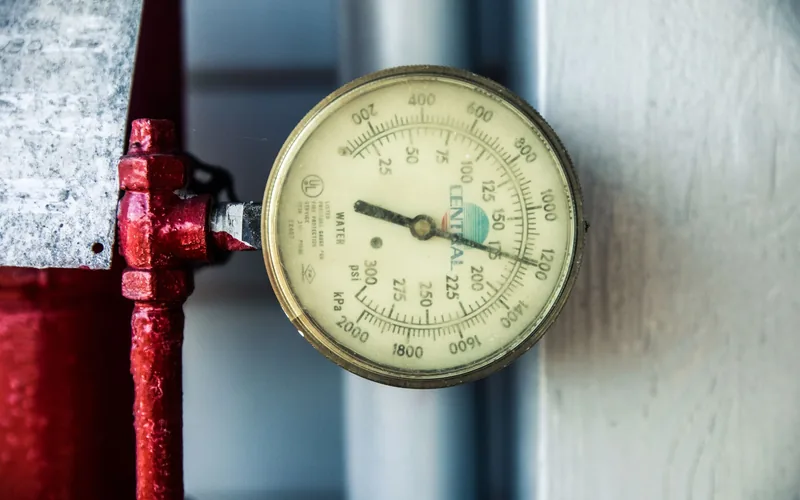 Pressure gauge on a water line used to confirm a leak